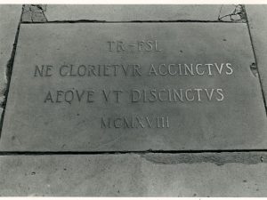 Plaque on Long Walk commemmorating the honorary degree awarded Theodore Roosevelt by Flavel Sweeten Luther. (Photographer unknown, 1919)